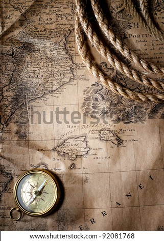 old compass on vintage map, 1732 Spain and Portugal, (author Ioh.Bapt.Homann) Nuremberg, Germany