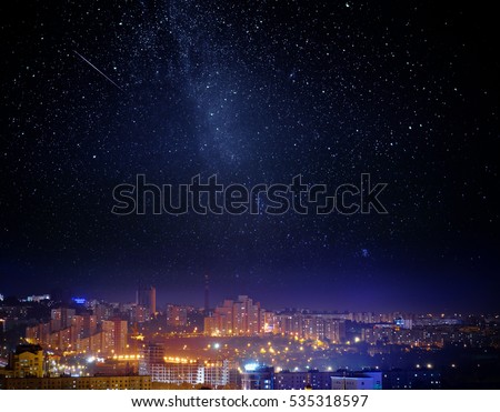 City landscape at nigh with sky filled with stars. Elements of this image furnished by NASA. ストックフォト © 