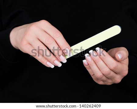 Well-groomed female hands and the varnished nails
