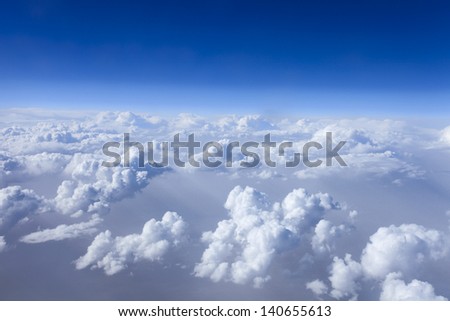 flying over a sea of clouds