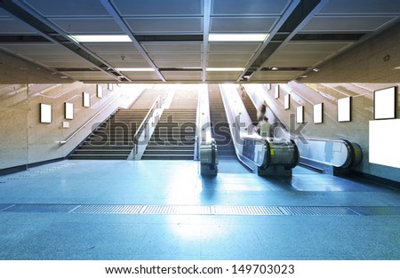 business people on elevator in metro station for transfer