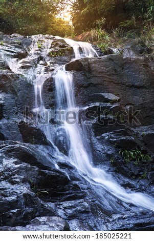 hiking on mountain meet waterfall in tropical rainforest