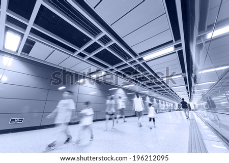lots of business people walk at subway station abstract blur