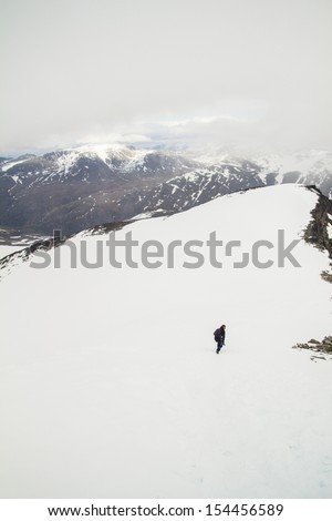 Man walking alone in the mountains.