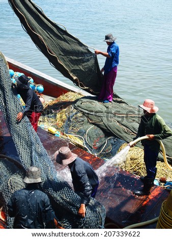 Chonburi, Thailand - May 28, 2011: Labors work on the fishing vessel on May 28, 2011 in Chon Buri Province,Thailand.