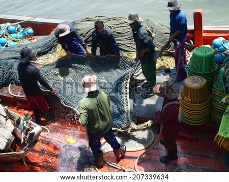 Chonburi, Thailand - May 28, 2011: Labors work on the fishing vessel on May 28, 2011 in Chon Buri Province,Thailand.
