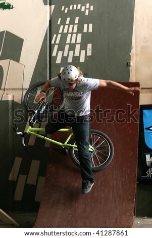 UKRAINE, KIEV - MAY 30: Alexey Serbin making jumps and tricks, at the extreme bicycle trial competition \