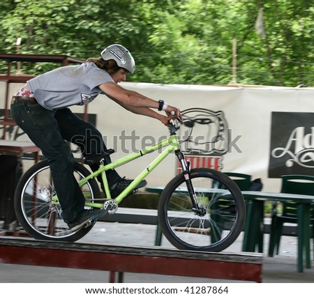 UKRAINE, KIEV - MAY 30: Alexey Serbin making jumps and tricks, at the extreme bicycle trial competition \