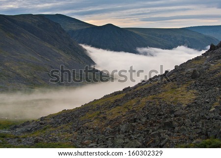 Mountain landscape with mist, Ural Mountains, Russia.