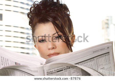 Businesswoman reviewing financial markets, stocks, money, business