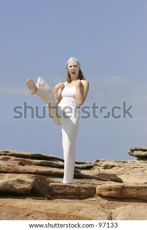 Woman does a large karate kick