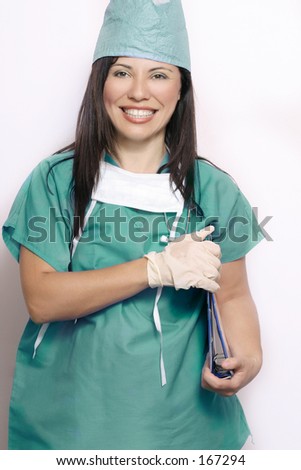 Smiling hospital worker in green/teal medical uniform