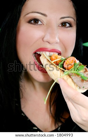 A woman eating a healthy lunch.