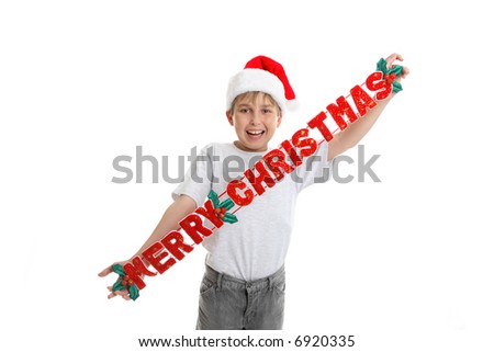 A child holding a fabric Christmas decoration,  that says Merry Christmas