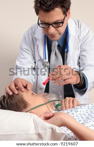 A doctor shining a light into a patient eyes checkup examination