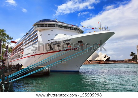 Sydney, Australia - September 15, 2013:  Carnival Spirit, of Carnival Cruise Lines,, at its dock port at Sydney Harbour. Passengers await its departure for a 12 night Pacific Islands Cruise.