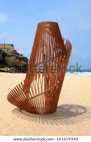 BONDI BEACH, AUSTRALIA - OCTOBER 29, 2013: Sculpture By The Sea..  Sculpture titled \'Ephermeral Aura\' by Thomas Murray and Nicole Larkin (NSW).  Medium birch plywood, brushed stainless steel