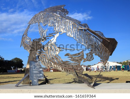 BONDI BEACH, AUSTRALIA - NOVEMBER 3,  2013: Sculpture By The Sea, Bondi 2013.  Sculpture titled Breach\' by Michael Snape (NSW).  Medium stainless steel