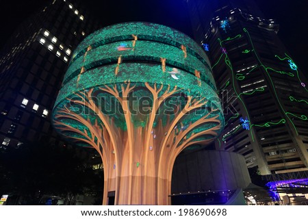 SYDNEY, NSW, AUSTRALIA - JUNE 6, 2014; A day in the life of a mighty forest tree - Vivid installation on Commercial Travellers Association building at Martin Place,  Sydney