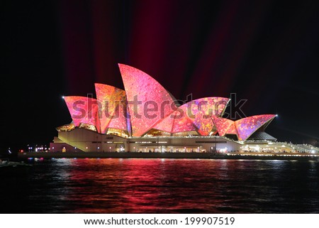 SYDNEY, AUSTRALIA - JUNE 2, 2014;  Vivid Sydney Festival, beautiful bright pink and yellow imagery projected onto the  Sydney Opera House  during Vivid  annual festival of light, music and ideas