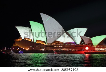 SYDNEY, AUSTRALIA - MAY 23, 2015;  Sydney Opera House  illuminated in metallic grey and green colours during Vivid Sydney annual festival.