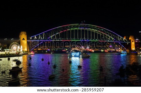 SYDNEY, AUSTRALIA - JUNE 6, 2015 - Harbour views from Lavender Bay across to Luna Park, Sydney Harbour Bridge, Opera House and city buildings during Vivid Sydney annual festival.