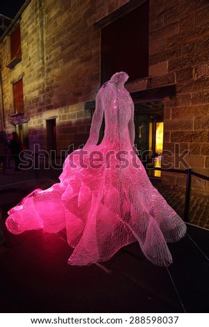 SYDNEY, AUSTRALIA -JUNE 2, 2015;  The Dresses shapes hundreds of fibre-optic strands into the form of three beautiful and extravagant dresses.   Artist Tae Gon Kim