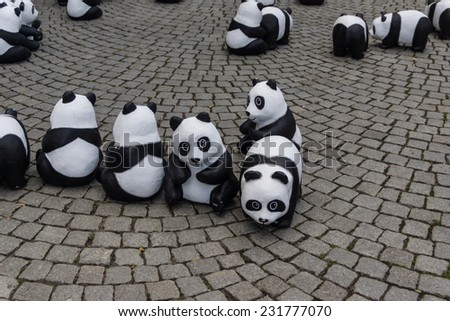 KIEL, GERMANY - AUGUST 14 2013: The WWF draws attention to the endangered giant panda with an action in the city of Kiel
