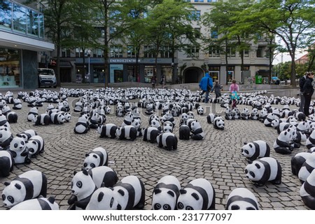 KIEL, GERMANY - AUGUST 14 2013: The WWF draws attention to the endangered giant panda with an action in the city of Kiel