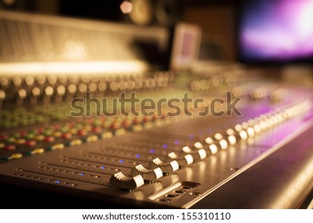 Professional mixing console in studio