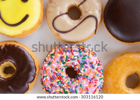 Colorful donuts in box