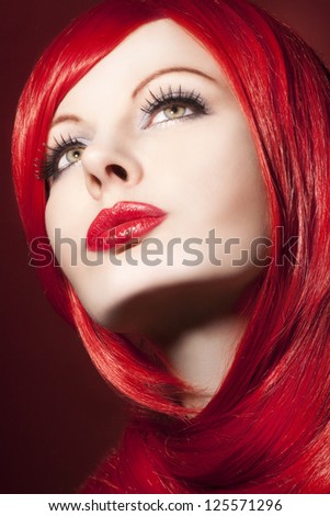 Beautiful woman with shiny red hair