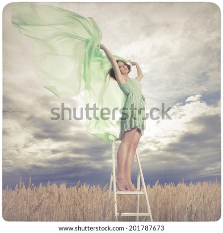 Beautiful woman in green dress background