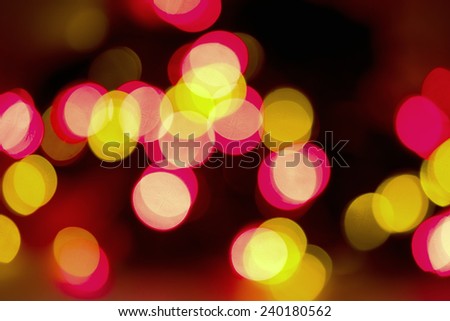 Festive Christmas lights background. Defocused Bokeh twinkling Lights Festive holiday party background with blurry special magic effect.