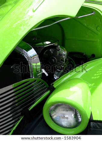 Green 1939 antique car, head lamp, grill and engine