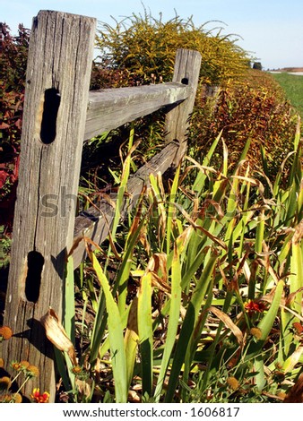 Country fence and garden on Midwestern farm, Illinois