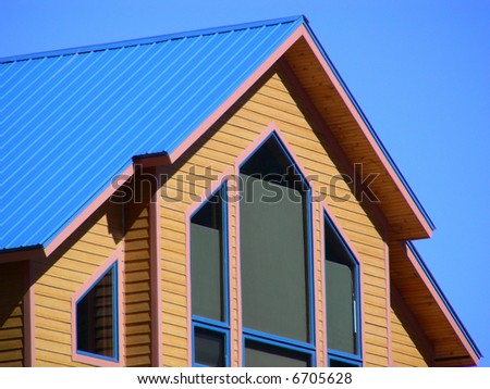 Metal roof and picture windows in a mountain home