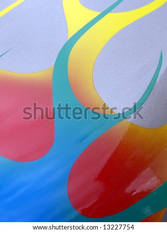 Curves and swirls of color on metal
