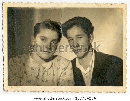 CENTRAL BULGARIA, BULGARIA - CIRCA 1950 - Common portrait of young woman and young man (lovers) - Note: slight blurriness, better at smaller sizes - circa 1950
