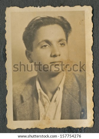 CENTRAL BULGARIA, BULGARIA - CIRCA 1945 - Common portrait of young man (still teenager) - Note: slight blurriness, better at smaller sizes - circa 1945