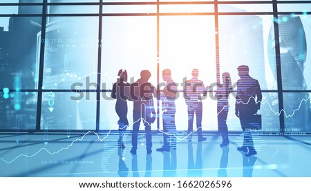 Silhouettes of business people in panoramic Moscow city office with double exposure of blurry digital graph. Concept of stock market and teamwork. Toned image