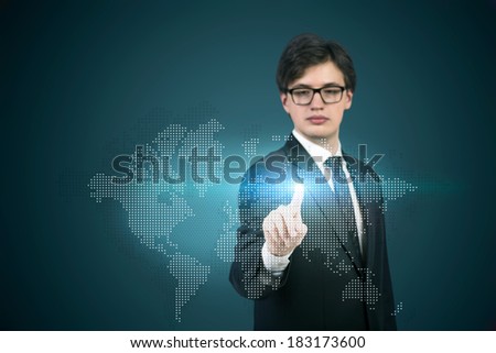 A businessman pointing out to the hologram map