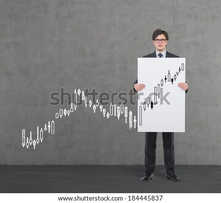A businessman holding a poster and quotation of the stock exchange