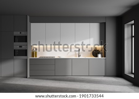 Interior of modern kitchen with gray and white walls, concrete floor and grey and white cupboards with built in appliances. 3d rendering