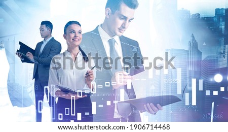 Portrait of three young diverse business people working together in blurry abstract city with double exposure of financial charts. Toned image