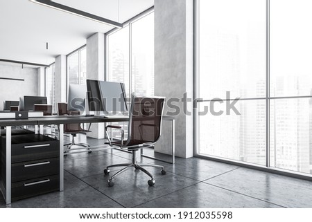 Office room with armchairs and computers on the tables near windows. Light grey office room with modern minimalist furniture, 3D rendering no people