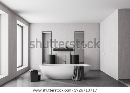 Modern bathroom interior with white bathtub and two marble sinks with rectangle vertical mirrors, in eco minimalist style with concrete floor and walls. Panoramic window. No people. 3D Rendering
