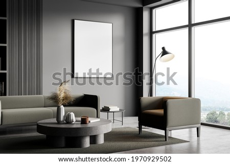 Living room interior with armchair and sofa, coffee table with books and decoration, concrete floor. Panoramic window with countryside. Mockup blank copy space frame, 3D rendering