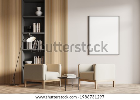 Interior of stylish living room, office lounge or home library with white walls, wooden floor, two comfortable armchairs and gray and wooden bookcase. Vertical mock up poster frame. 3d rendering