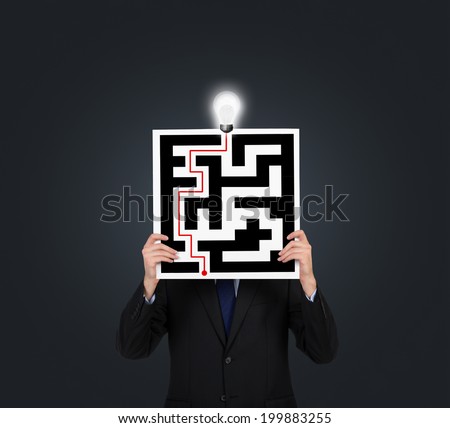 Confused businessman brainstorming the labyrinth to find the solution